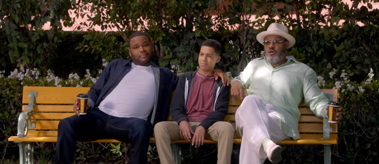 Three actors from the show &quot;Blackish&quot; sit on a park bench