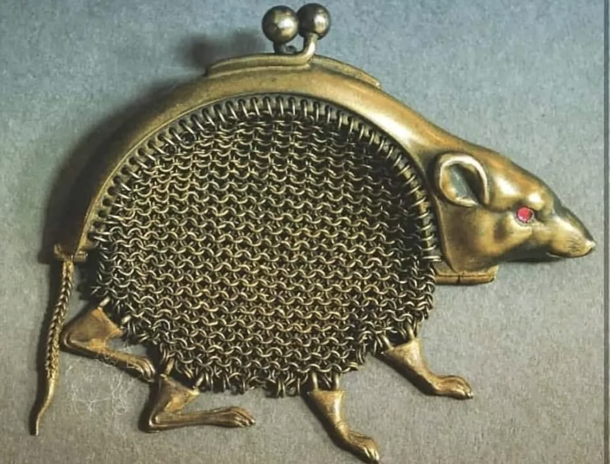 Antique metal purse designed to resemble a rat with a clasp on top