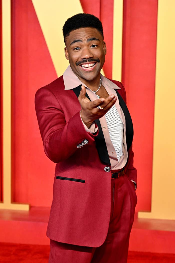 closeup of donald on the red carpet in a bright suit