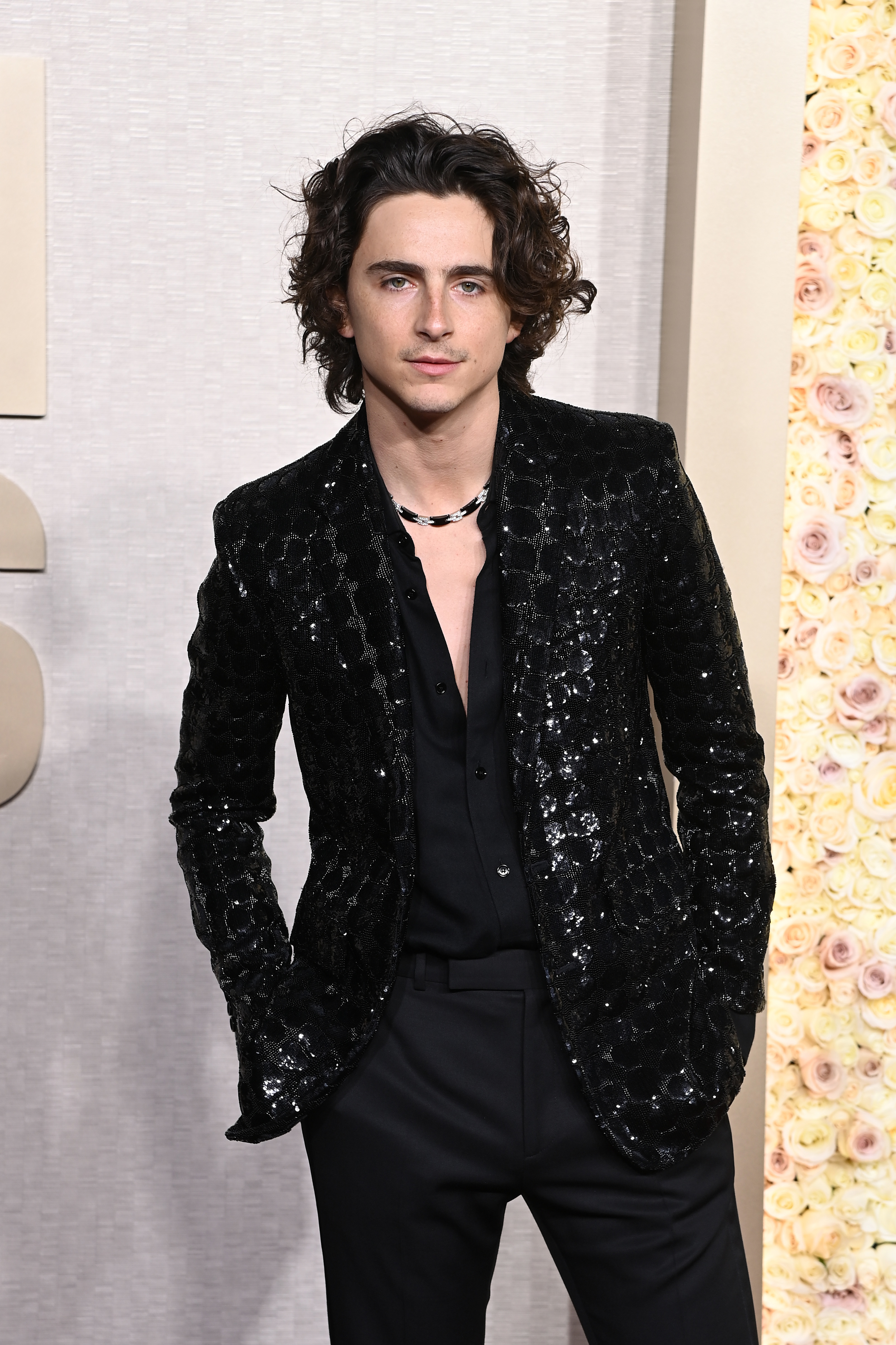 closeup of timmy in a suit at an event