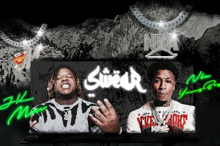 Billboard featuring rappers NBA YoungBoy with artistic graffiti-style signatures