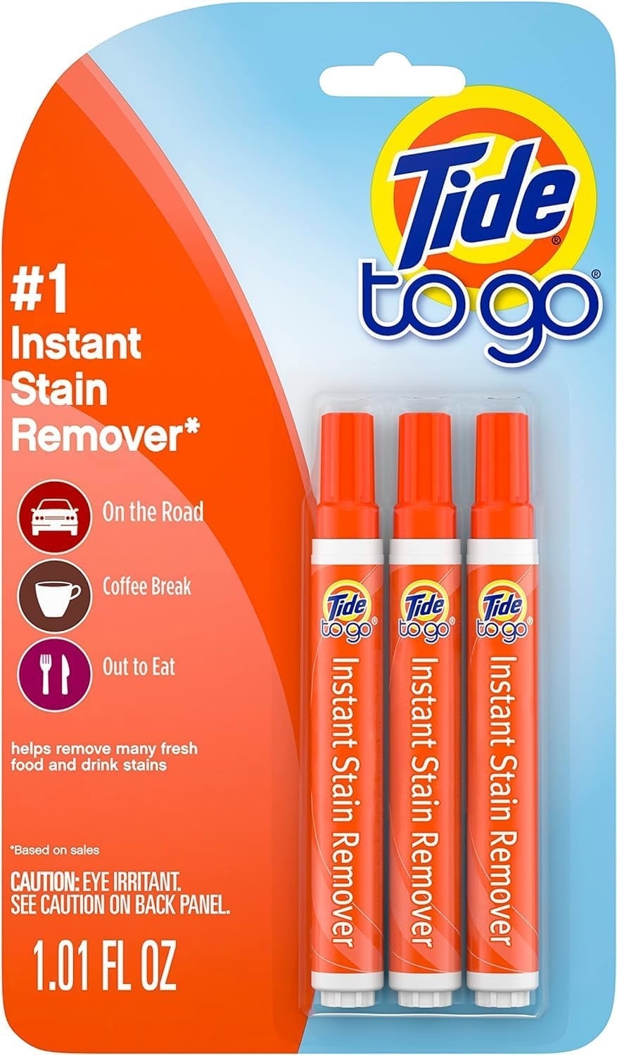 Three Tide to Go instant stain remover pens in packaging, emphasizing portable stain treatment
