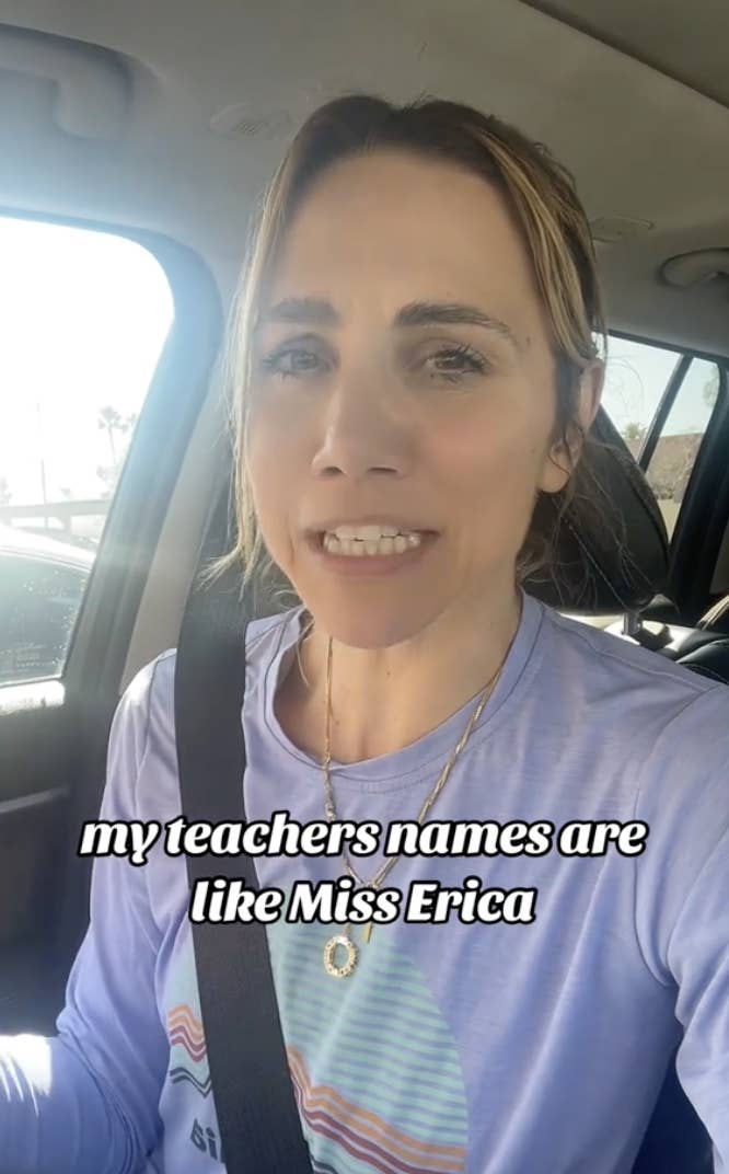 Woman in a car wearing a seat belt, speaking, with text overlay about teachers&#x27; names