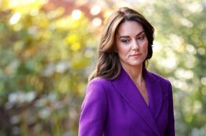 Kate Middleton in a purple blazer standing outside