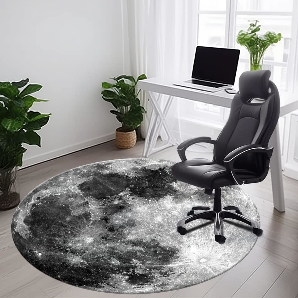 Office with a round moon-patterned rug and an ergonomic black chair, suitable for a home workspace upgrade