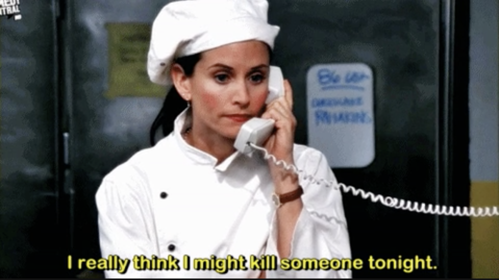 Monica Geller from Friends dressed as a chef on the phone, looking concerned with comedic text overlay