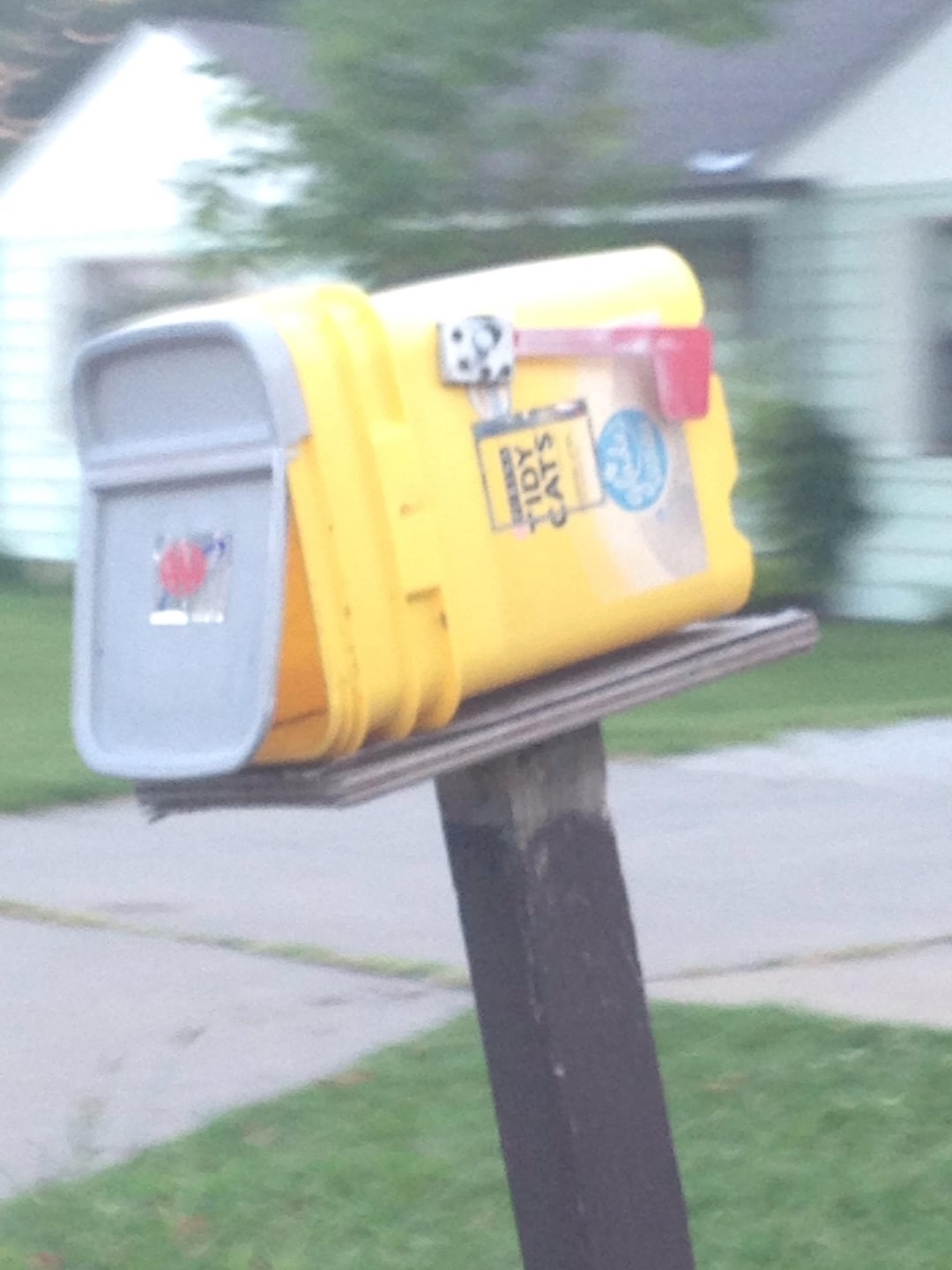 A plastic bin used as a mailbox