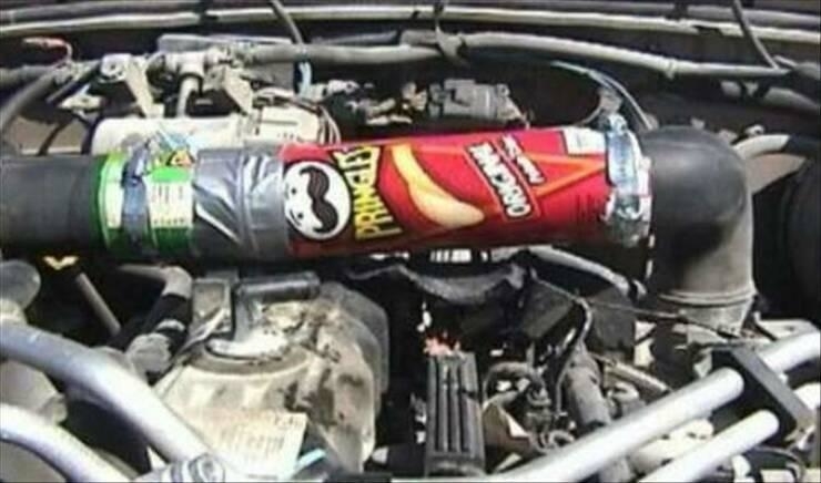 Can of Pringles used as a makeshift vehicle repair part under car hood