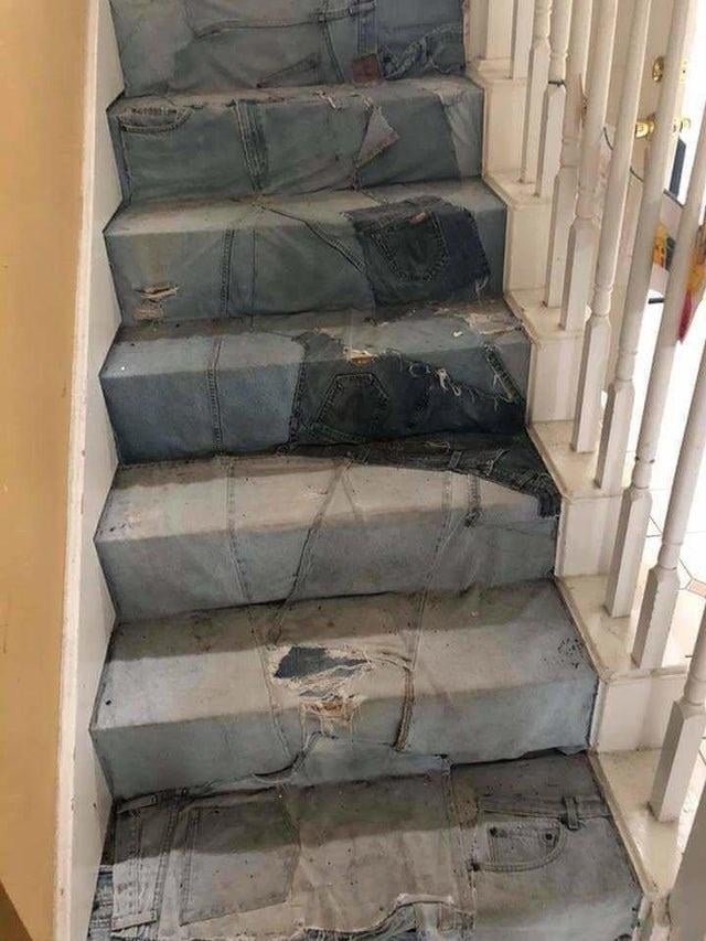 Staircase with jeans creatively laid on each step to give the illusion they are denim stairs