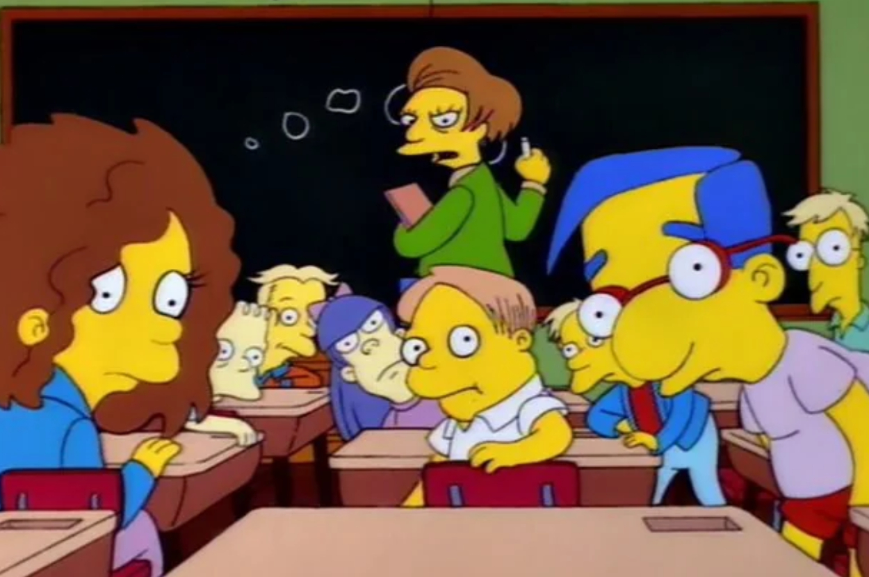 Ms. Krabappel teaches as Bart and other students listen in a classroom from &quot;The Simpsons.&quot;