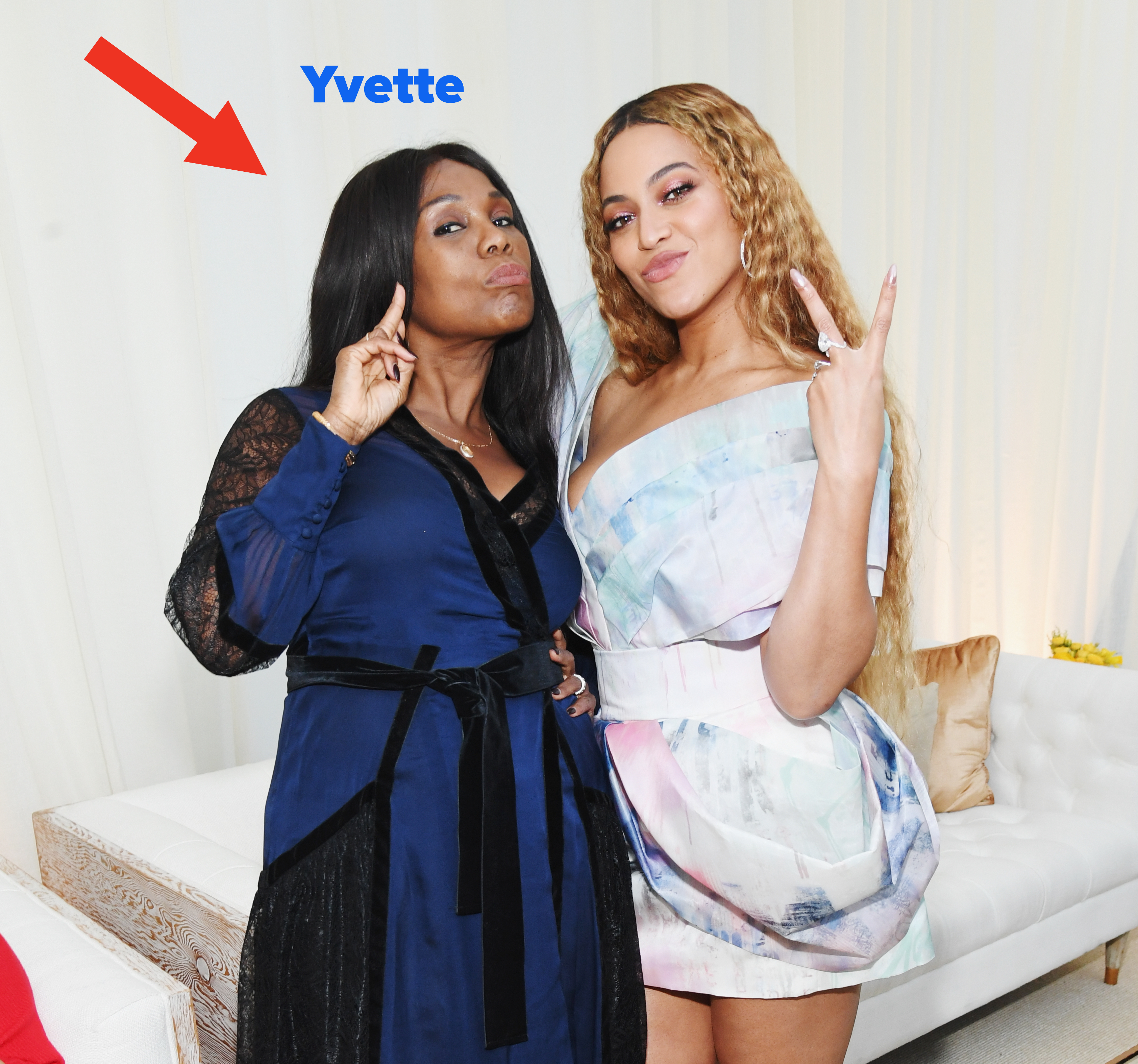 Closeup of Yvette and Beyoncé playfully posing for a photo