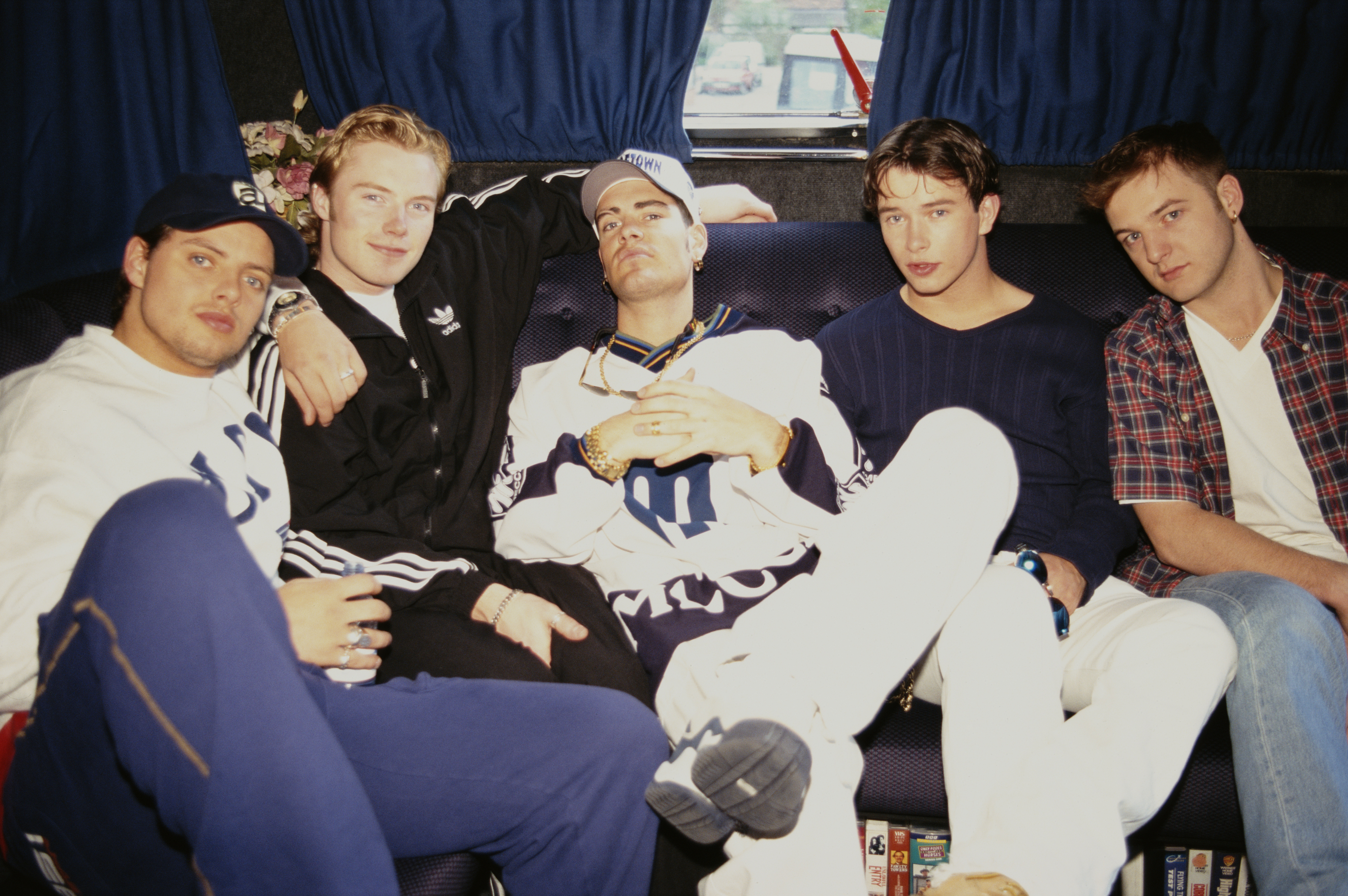 Boyzone pictured sitting on a couch in 1996