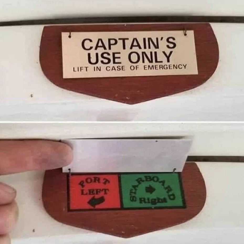 Sign reading &#x27;CAPTAIN&#x27;S USE ONLY&#x27; lifts to reveal navigation aids underneath