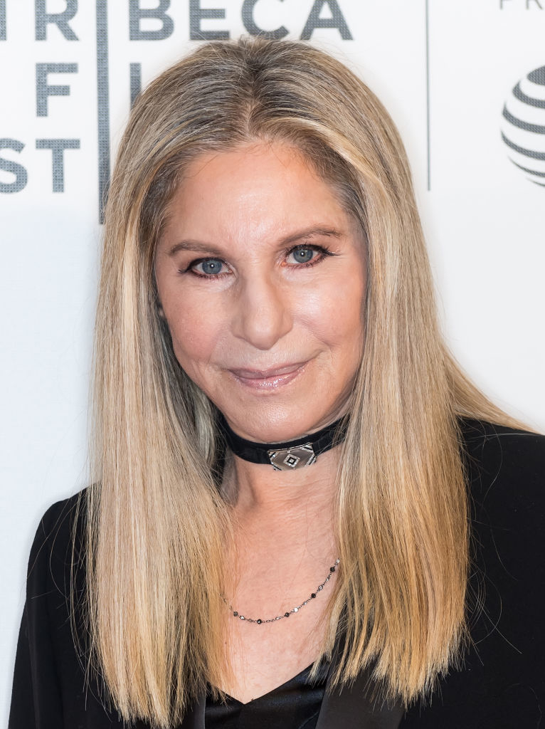 Barbra Streisand wearing a black top and a choker necklace