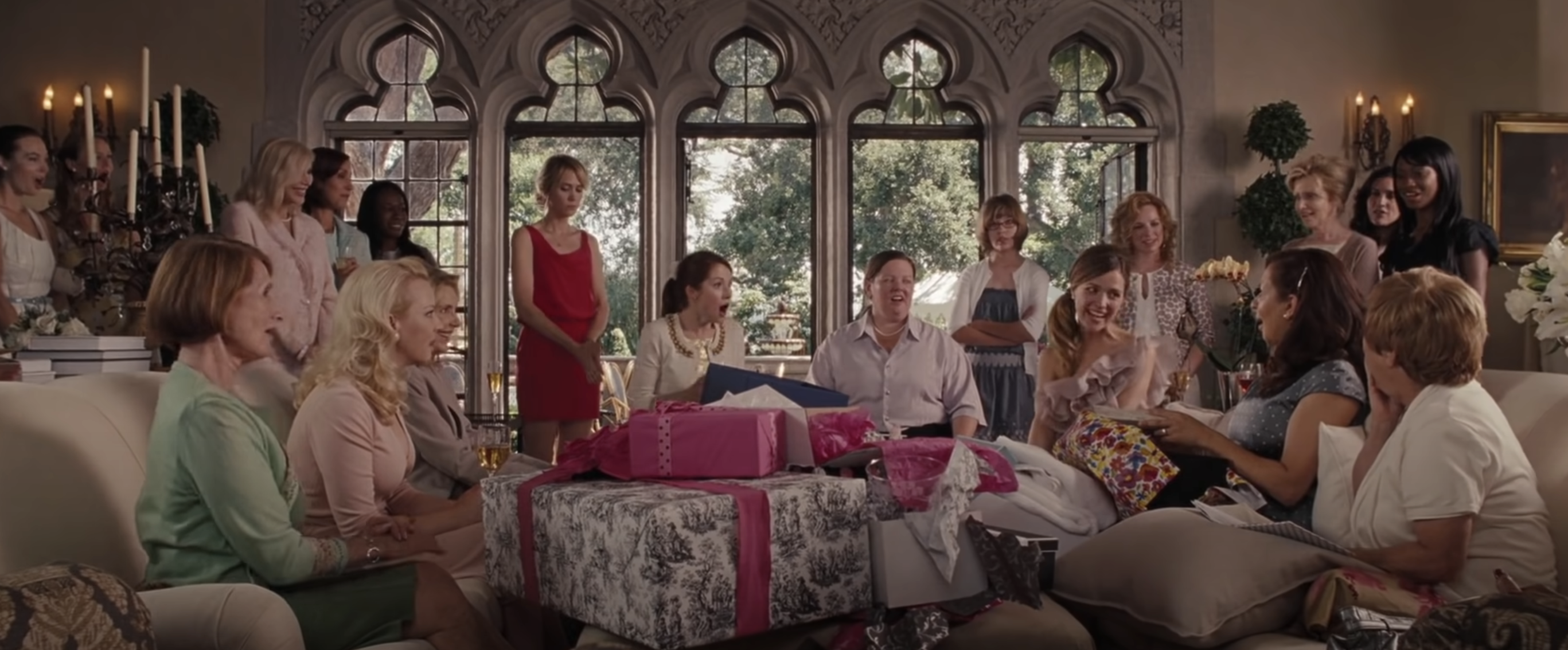 Group of women sitting in a room with presents, from the film &quot;Bridesmaids&quot;