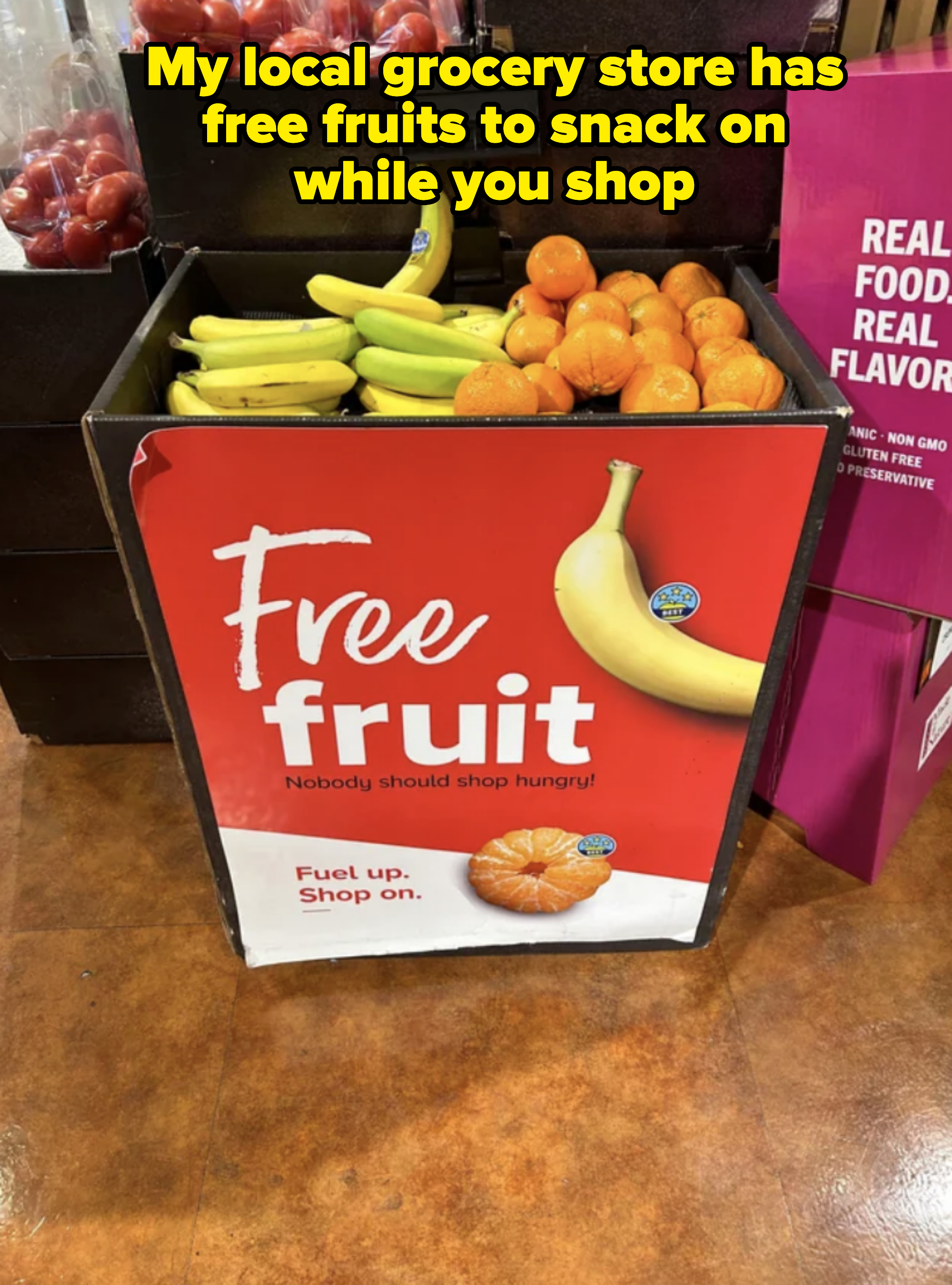 Sign at a store offering &#x27;Free fruit&#x27; with the text &#x27;Nobody should shop hungry! Fuel up. Shop on.&#x27; Bananas and oranges are pictured