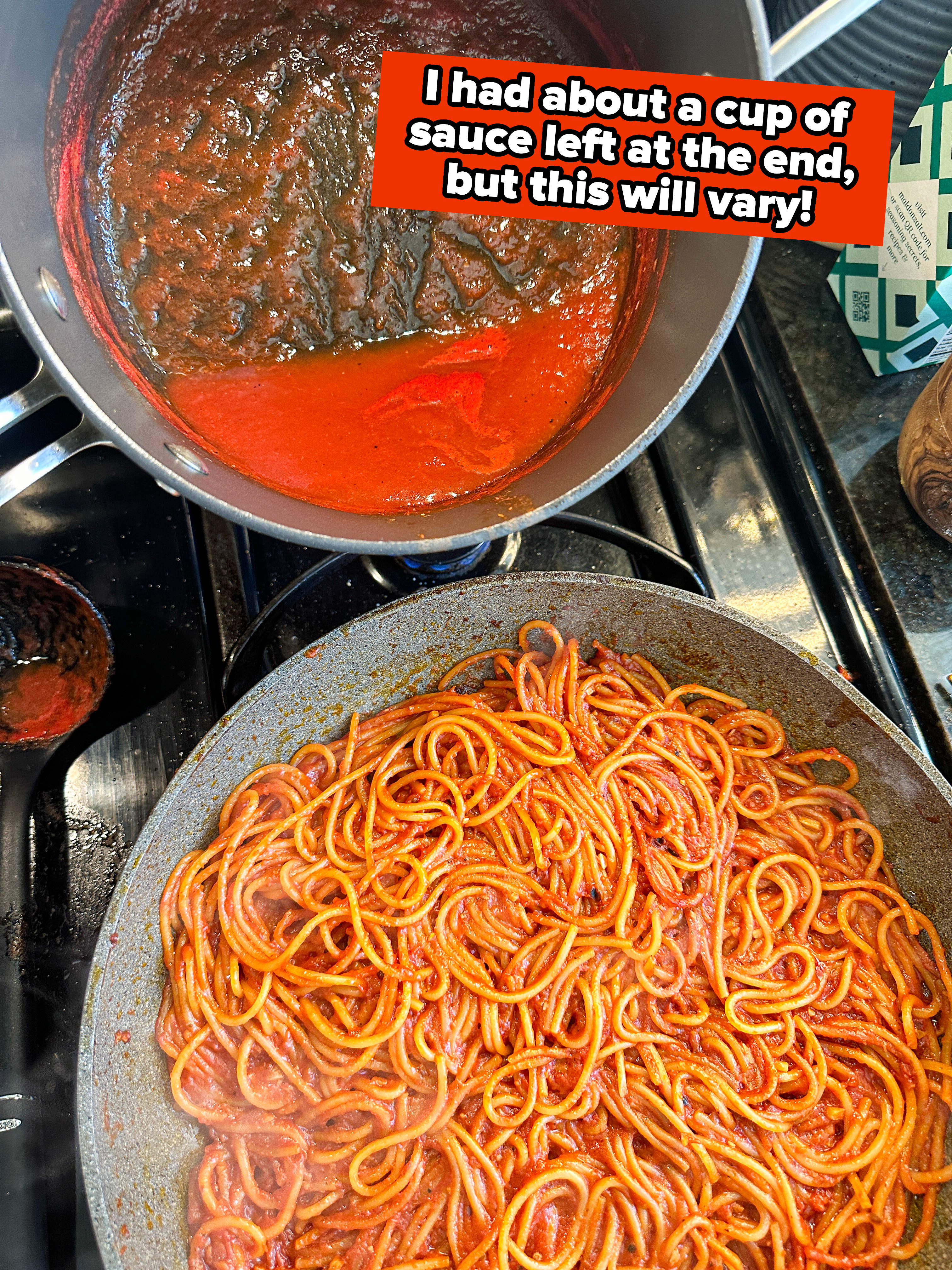 A pot of tomato sauce and a pan of spaghetti on a stove top
