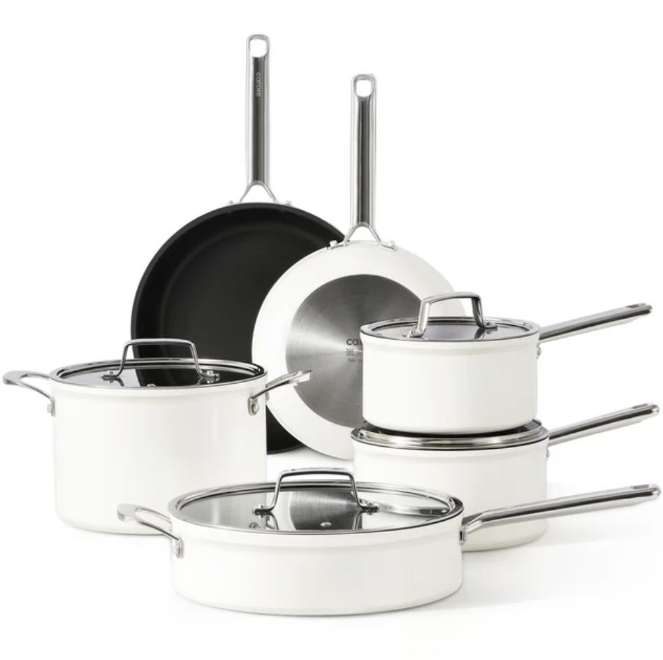 Four-piece stainless steel cookware set including pots and a pan, arranged for display