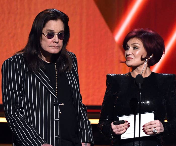 Ozzy and Sharon Osbourne standing at a podium with microphones