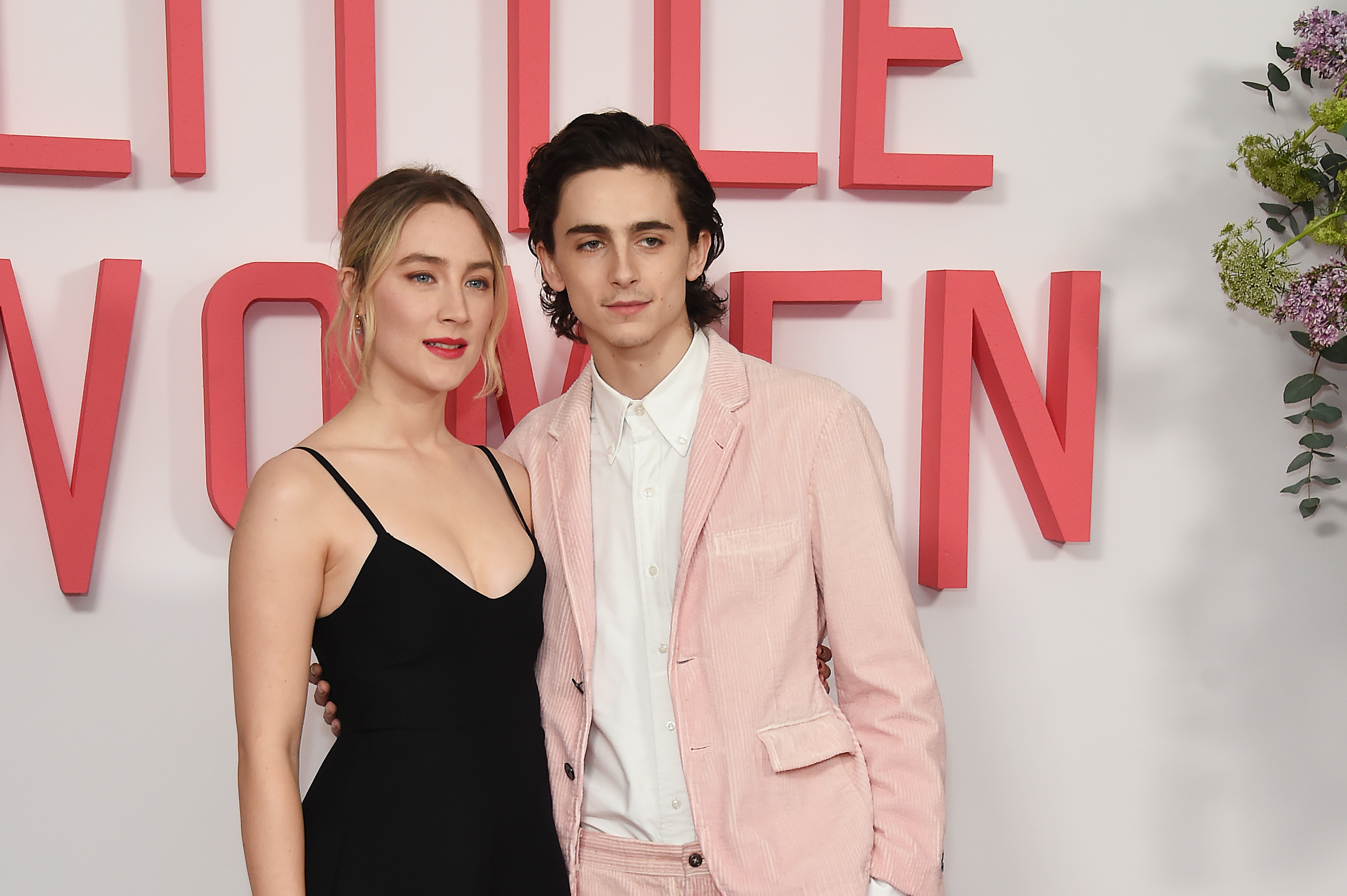 Saiorse and Timothée at the &quot;Little Women&quot; premiere, she in a black dress and he in a pink suit