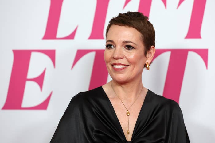 Olivia Colman in a V-neck dress at an event