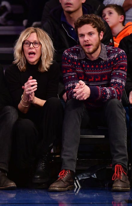 Meg and Jack sitting courtside at a basketball game