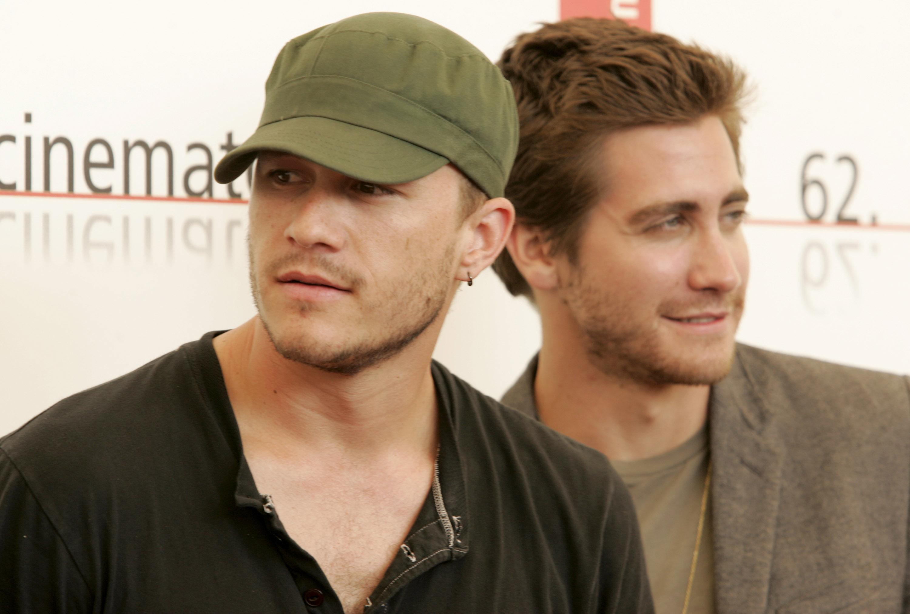 Heath in a cap and Jake with stubble, both casually dressed at a media event