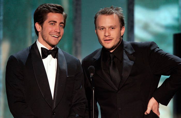 Jake and Heath in tuxedos presenting at an awards ceremony