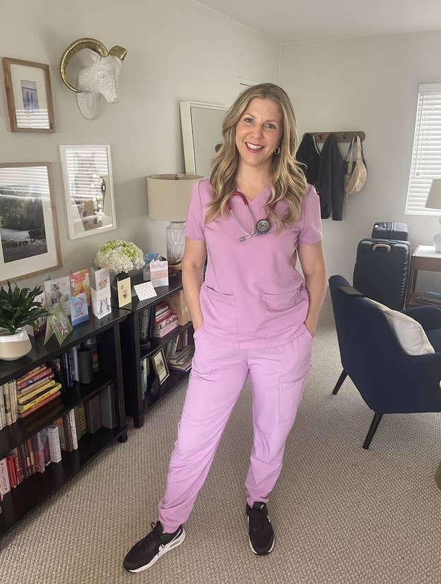 Julie in scrubs with a stethoscope, standing in an office setting