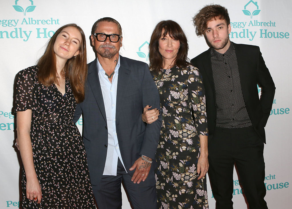 Katey and her family posing together at an event