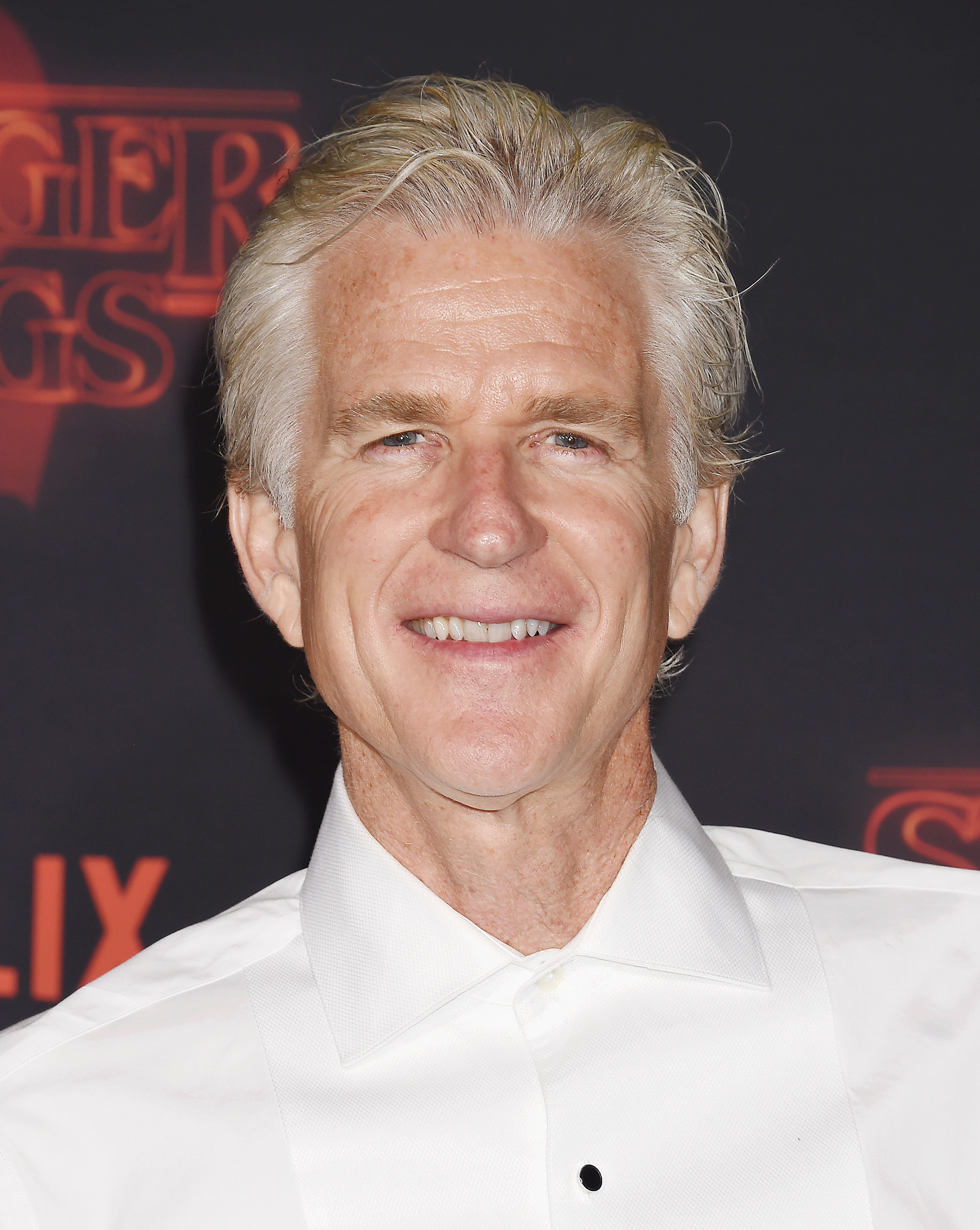 Matthew Modine at an event wearing a classic shirt with a buttoned collar