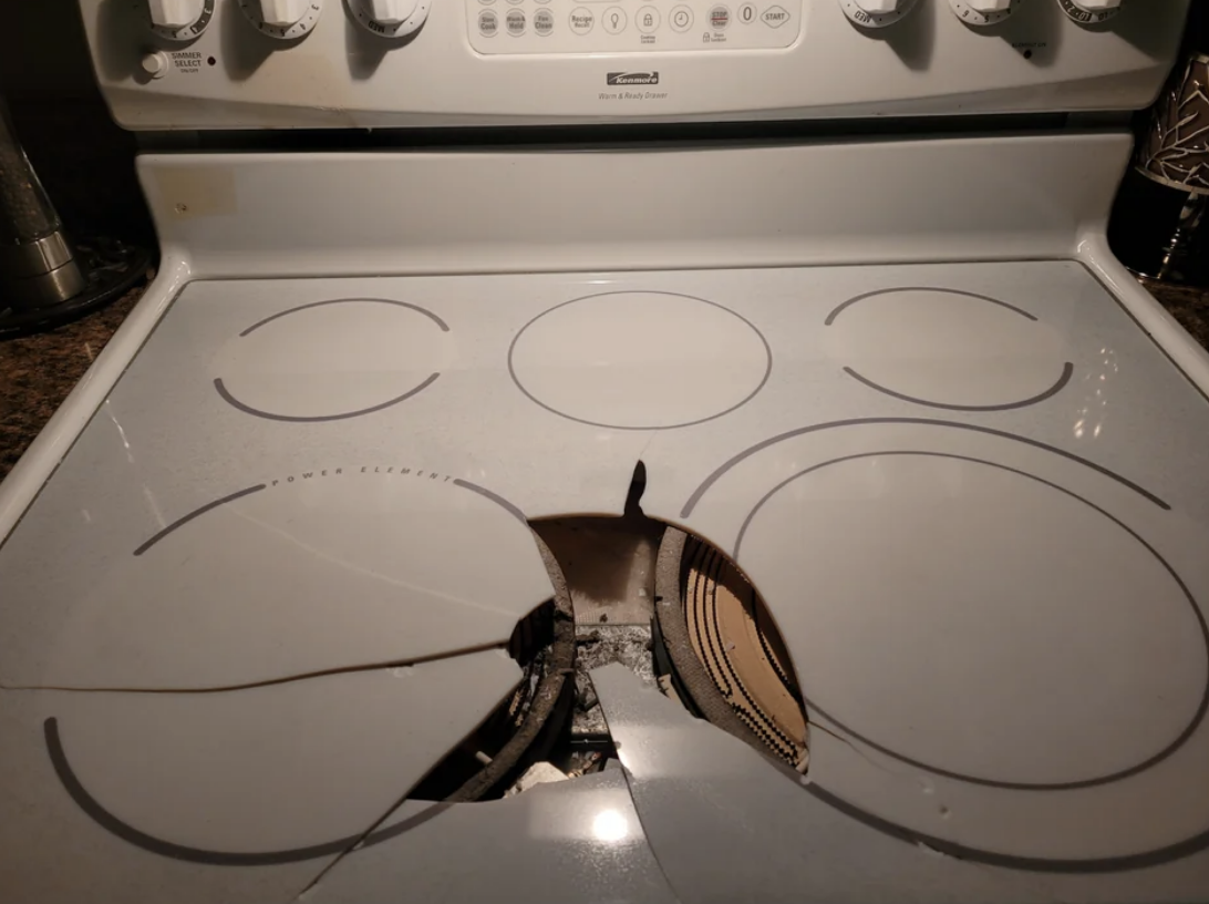 Ceramic cooktop with a broken heating element and visible damage