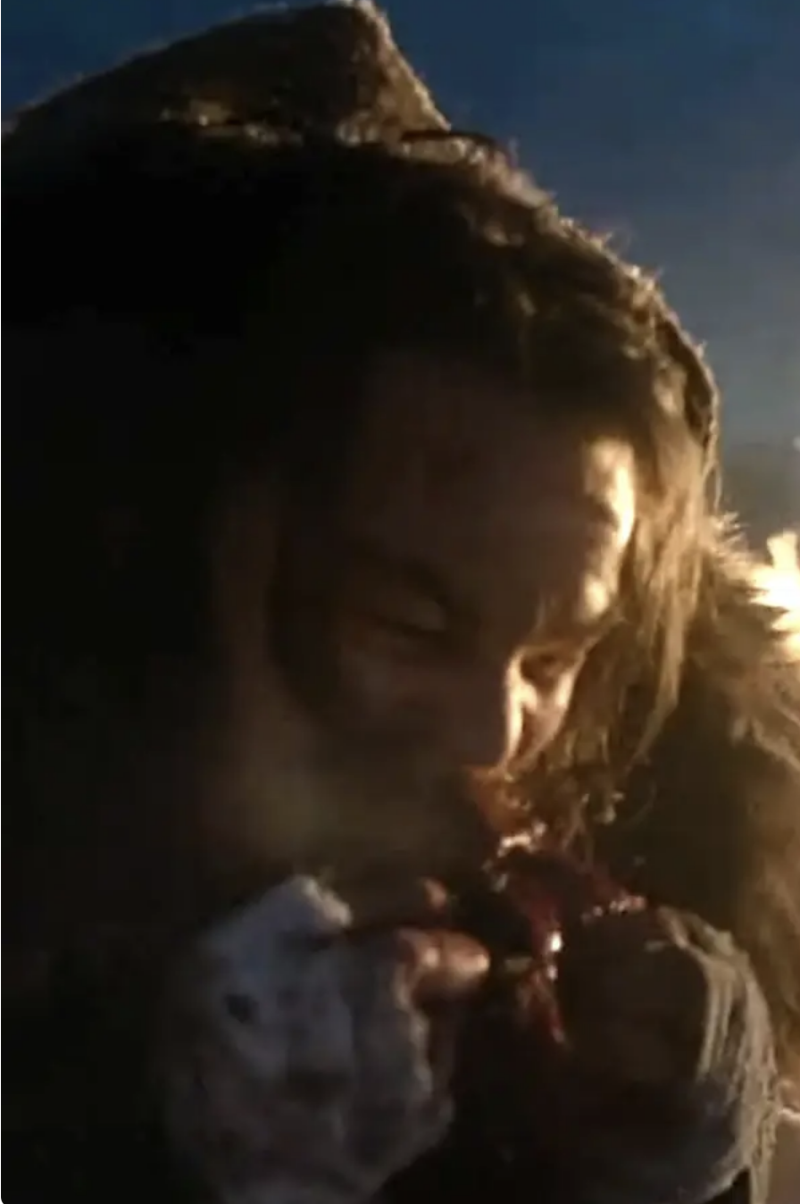 Leonardo DiCaprio as Hugh Glass in a scene from &quot;The Revenant,&quot; focusing closely on his face as he eats raw liver
