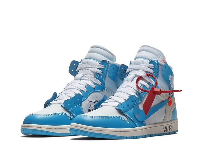 A pair of Off-White x Air Jordan 1 sneakers with signature cable tie on white background