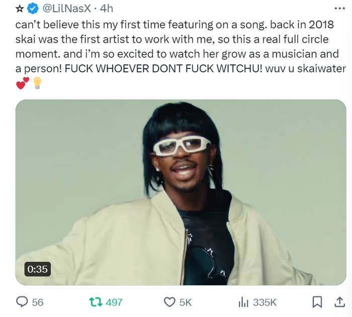 Lil Nas X in a video clip, wearing sunglasses and a light jacket, expressing excitement about collaborating with an artist