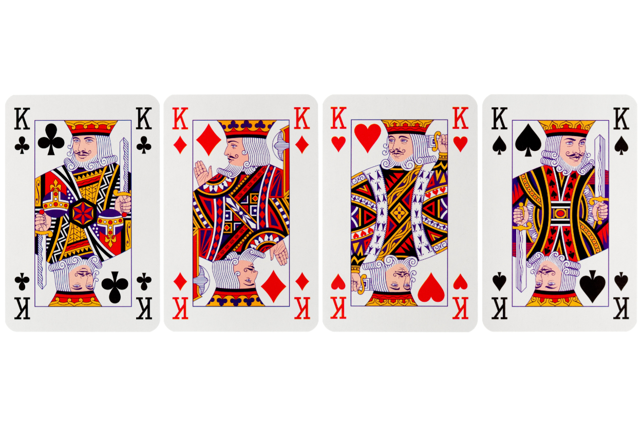 Four King playing cards from a deck displayed in a row, showing Kings of spades, diamonds, hearts, and clubs
