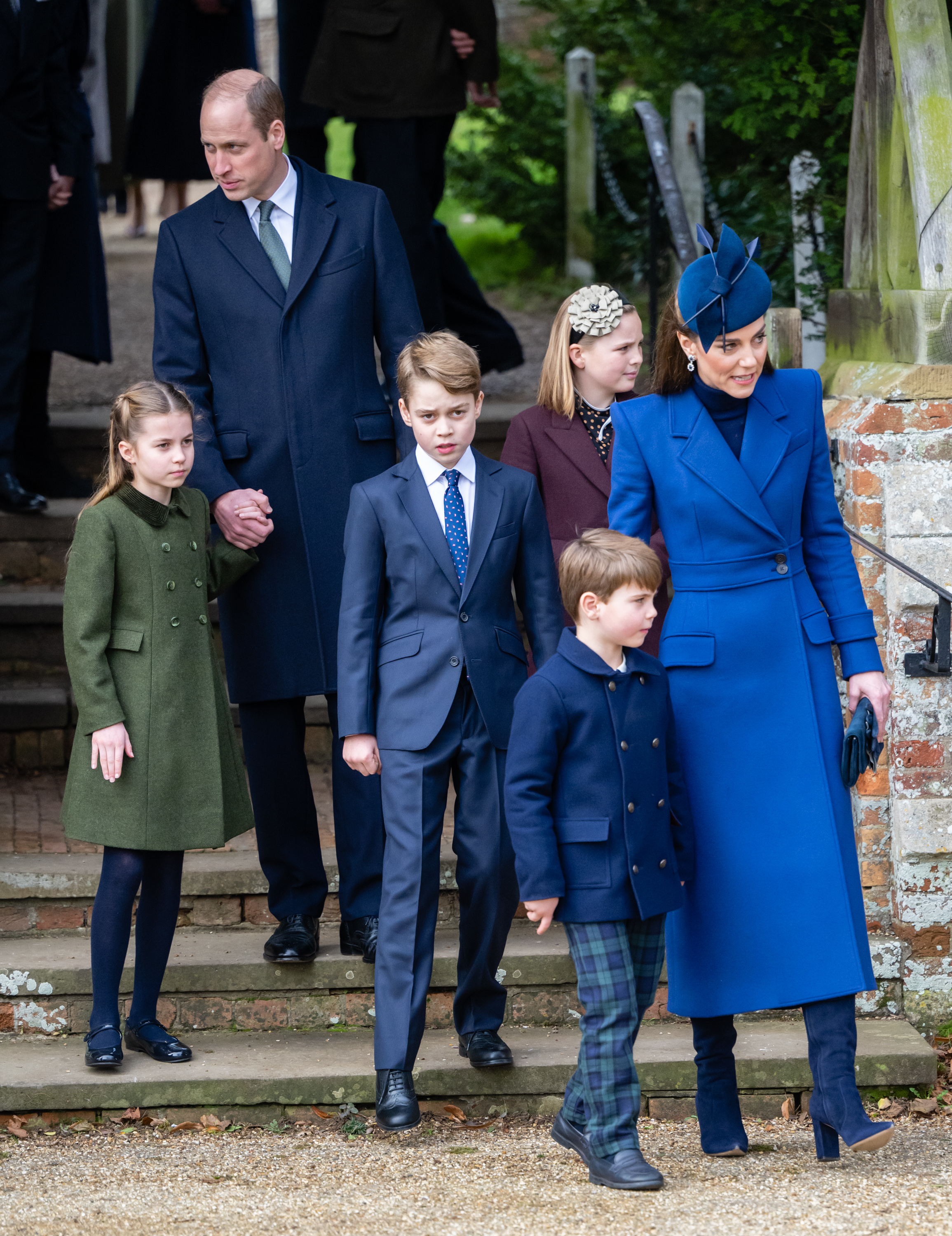 kate and william walking with their children at a royal event