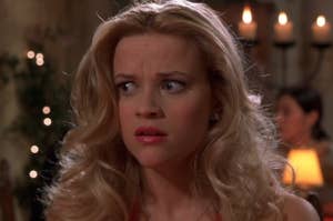 Elle Woods from Legally Blonde looks surprised in a courtroom scene