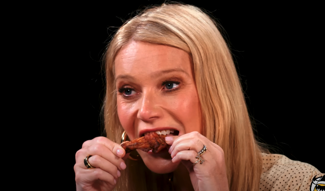 Gwyneth eating a chicken wing on the show &quot;Hot Ones&quot;