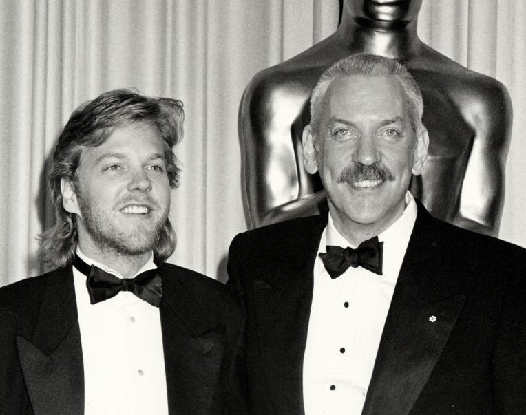 Kiefer with his father, Donald Sutherland, in formal black tuxedos at an awards event