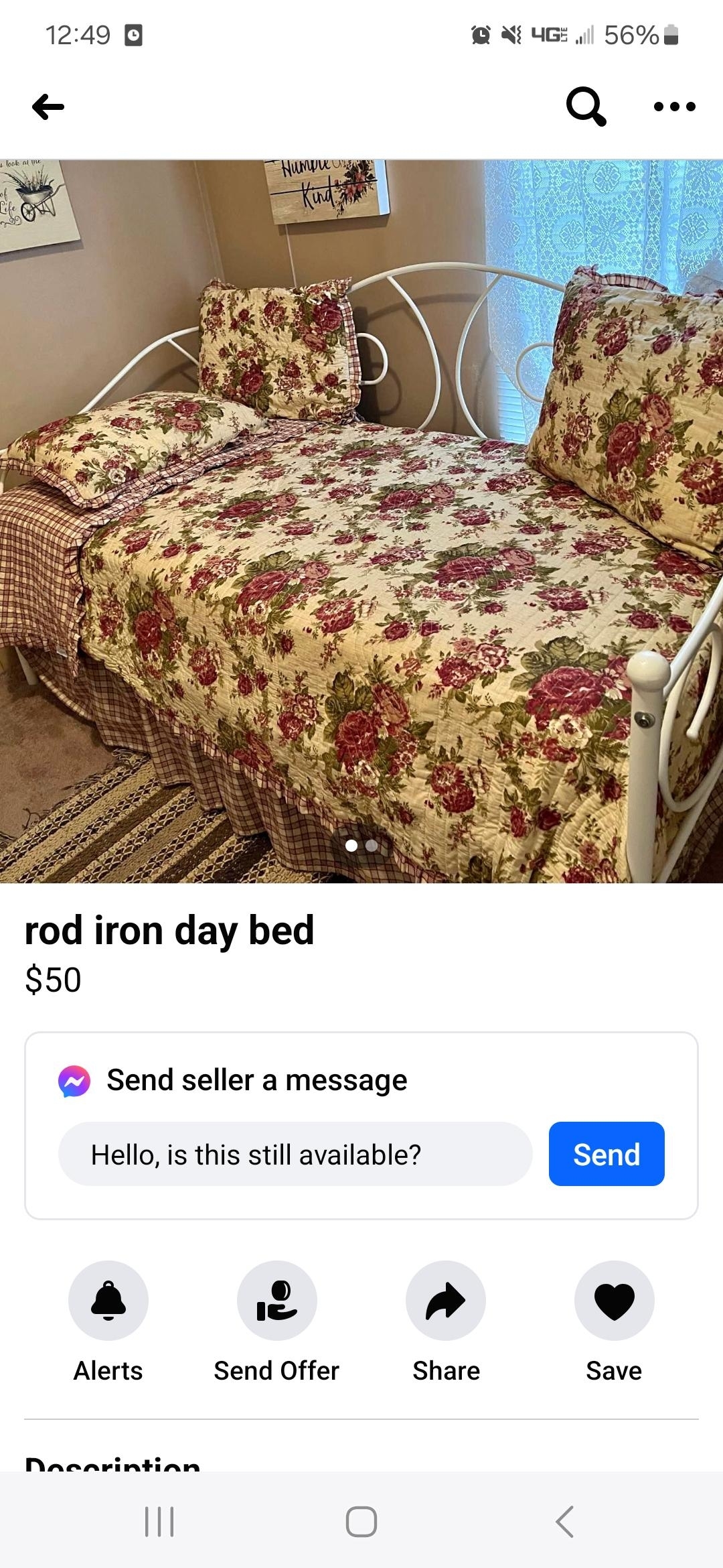 Photo of a rod iron daybed for sale with floral bedding in a bedroom setting