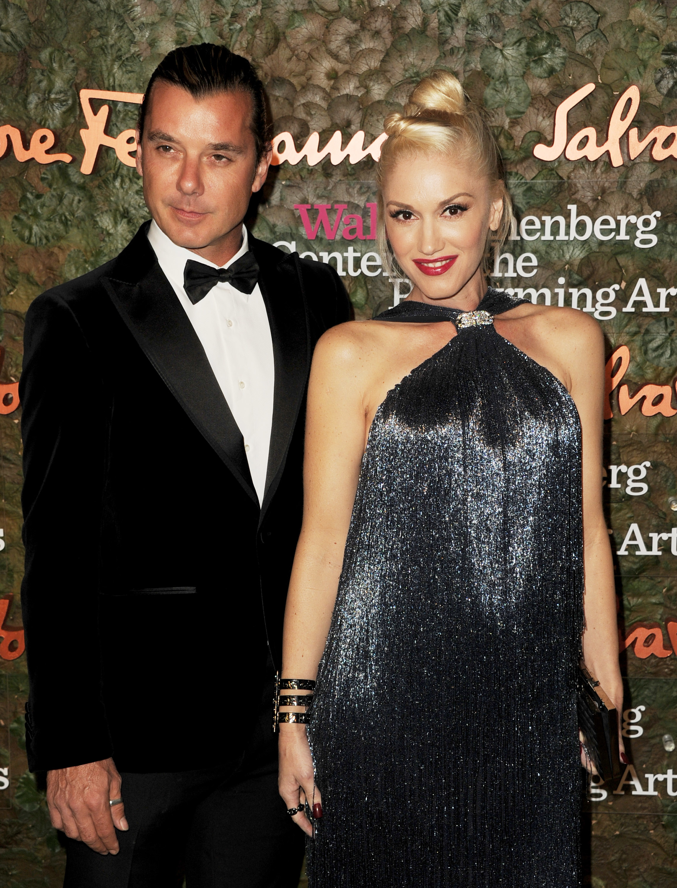 Gavin in a black tuxedo and Gwen in a glittering halter-neck dress