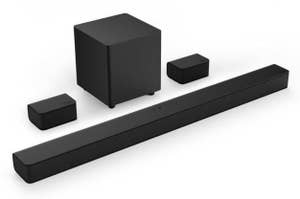 A soundbar with wireless subwoofer and rear speakers set on a white background, for home audio systems