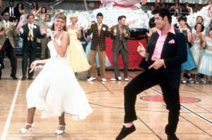 Sandy and Danny from Grease dancing in the school gym