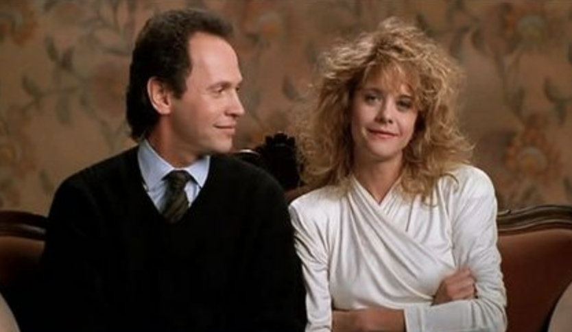 Billy Crystal and Meg Ryan in &quot;When Harry Met Sally...&quot; sitting together and smiling