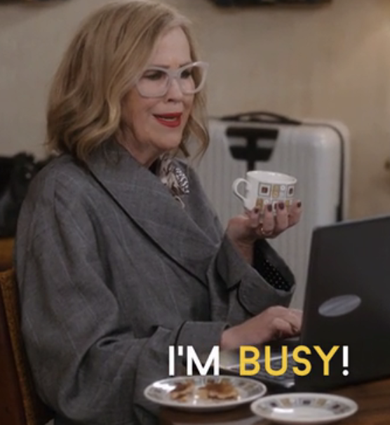 Catherine O&#x27;Hara in &quot;Schitt&#x27;s Creek&quot; holding a cup and saying &quot;I&#x27;m busy!&quot;