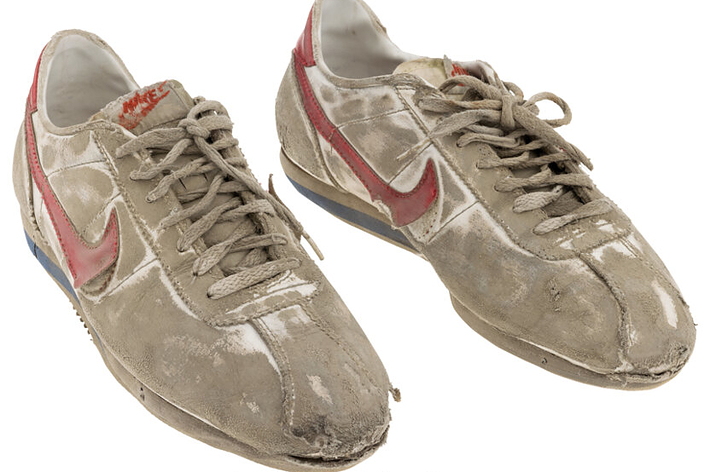 Vintage Nike sneakers with noticeable wear and dirt, no people in image