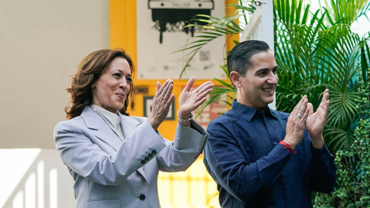 The VP unknowingly clapped to a song being sung to her in Spanish at the La Goyoco Community Center.