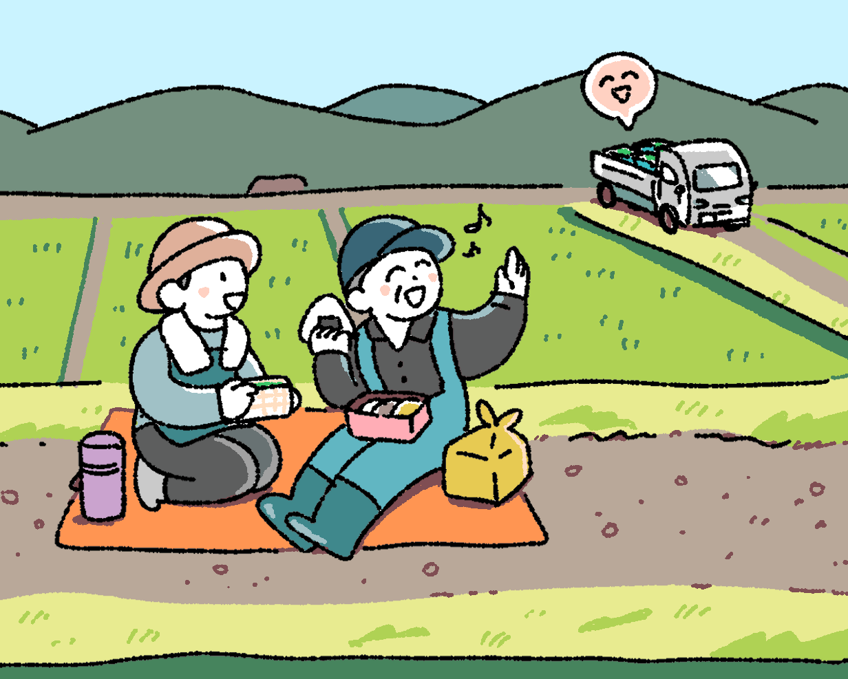 イラスト:ピクニックを楽しむ二人のキャラクターと後ろでトラックが走る風景。