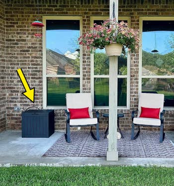 another reviewer's patio setup with deck box in the corner and yellow arrow pointing it out